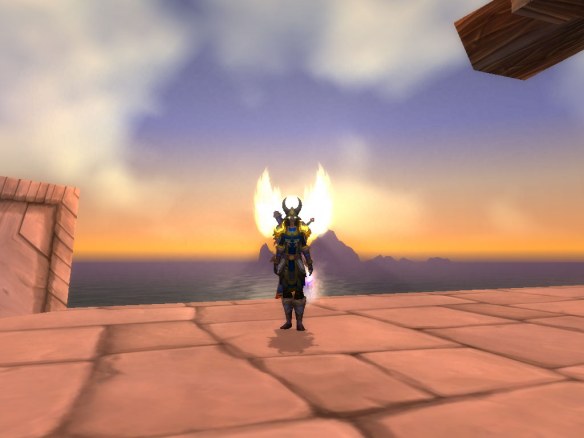 My paladin silhouetted by the sun in Stormwind Harbour