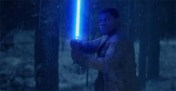 Finn (John Boyega) wields a lightsaber in Star Wars: The Force Awakens