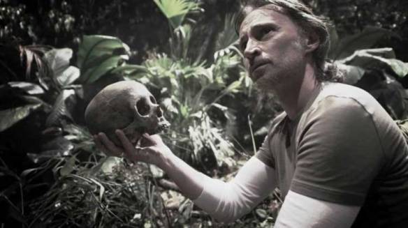 Dr. Rush examines his own skull in Stargate: Universe